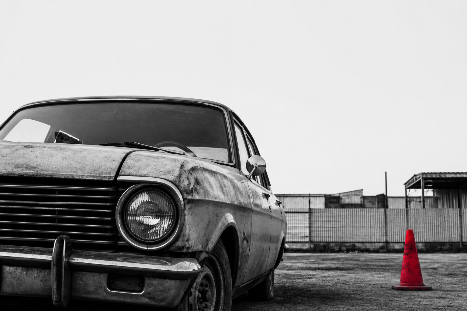 A damaged, non-running car parked in a driveway — proof we buy vehicles in any state